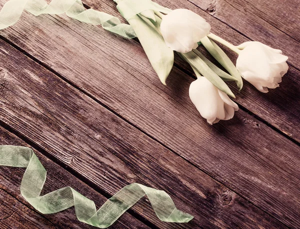 White tulips on wooden background — Stock Photo, Image