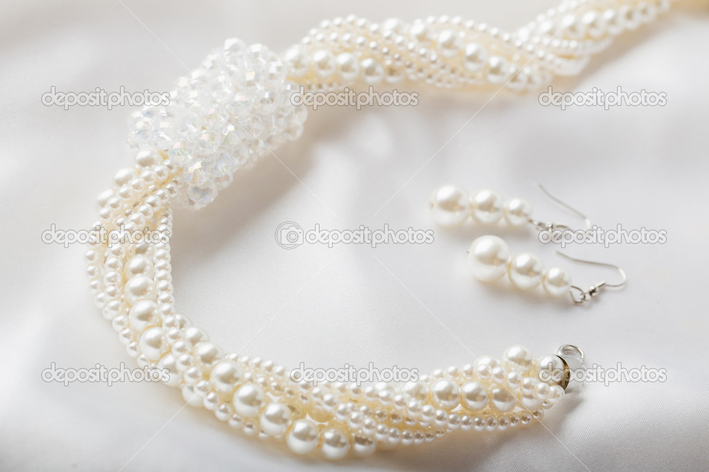 Pearl necklace on white background