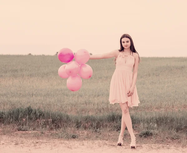 Girl with pink balloons — Stock Photo, Image