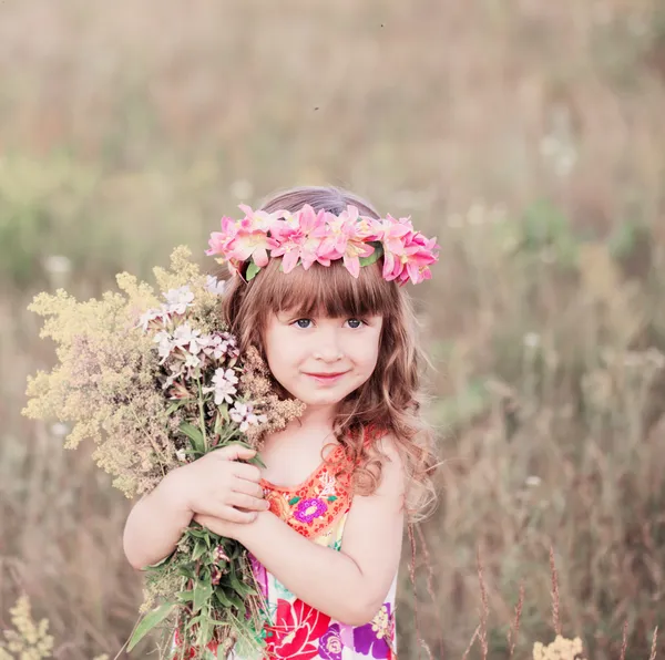 Beautiful girl hugging a bouquet — Stock Photo, Image