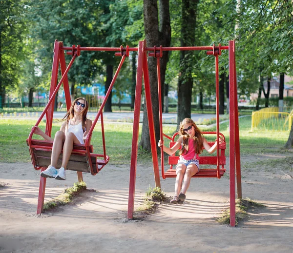 Two girls on swing — Stock Photo, Image