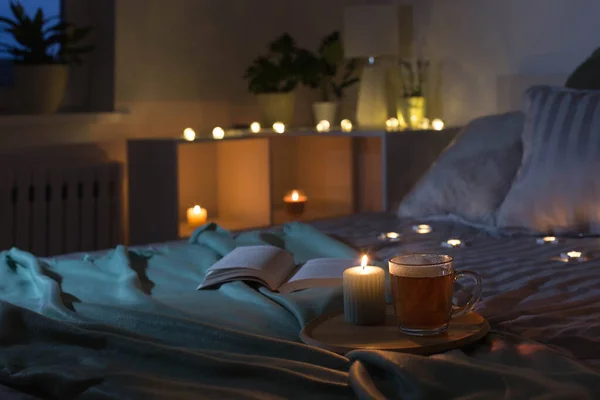 Cup Tea Burning Candle Wooden Tray Bed Bedroom Evening — Fotografia de Stock