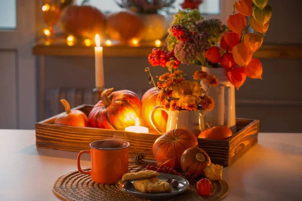 Orange Cup Tea Autumn Decor Pumpkins Flowers Burning Candles Table — Stock Photo, Image