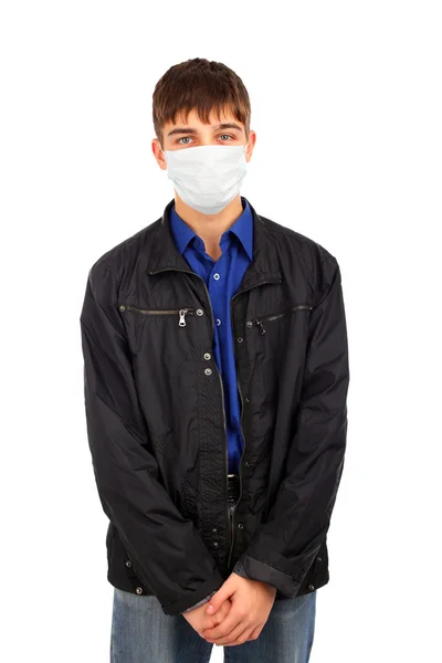Teenager v chřipky maska — Stock fotografie