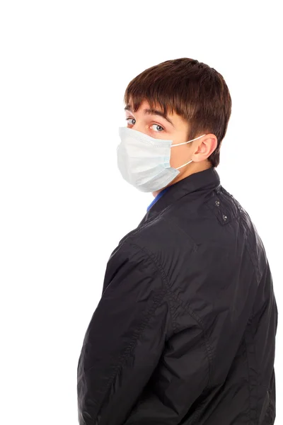 Teenager mit Grippe-Maske — Stockfoto