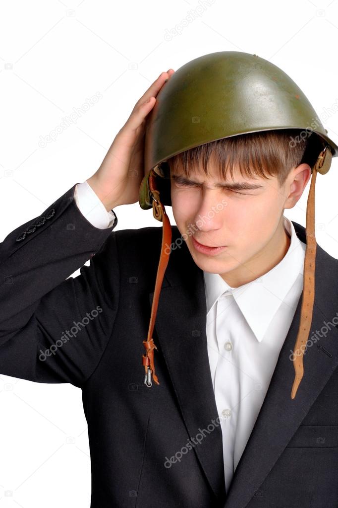 Teenager in military helmet