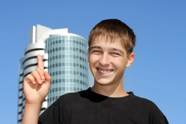 Tiener met vinger omhoog — Stockfoto