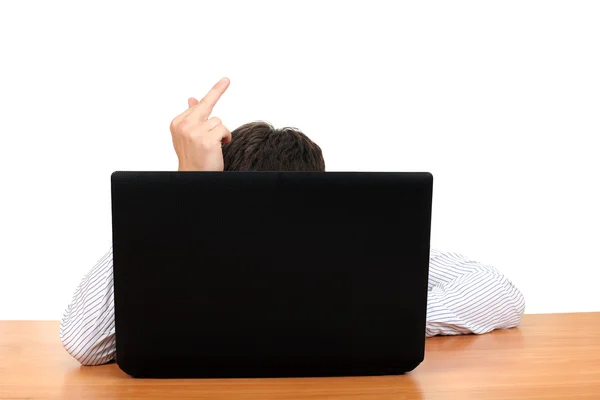 Middelste vinger achter laptop — Stockfoto