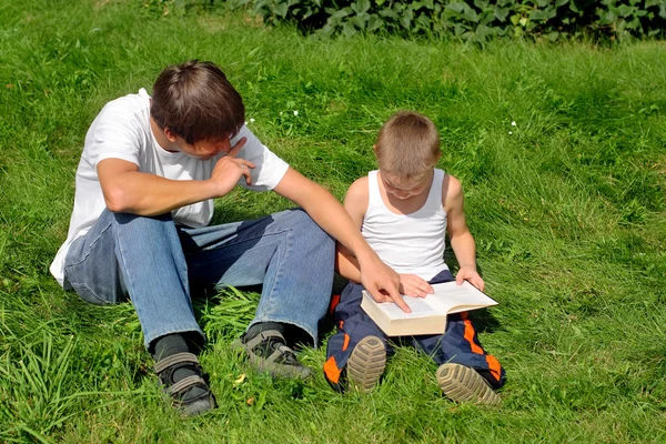 Brothers Reads Book — Stock Photo, Image