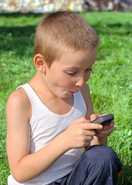 Ragazzo sorpreso con il telefono cellulare — Foto Stock