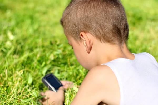 Criança com telefone celular — Fotografia de Stock