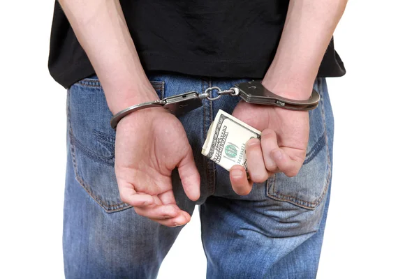 Handcuffs in Hands with Money — Stock Photo, Image