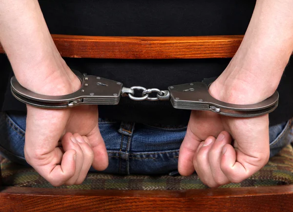 Handcuffs on Hands closeup — Stock Photo, Image