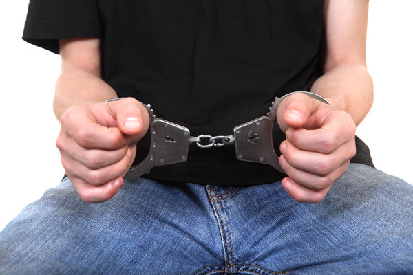 Handcuffs on Hands closeup