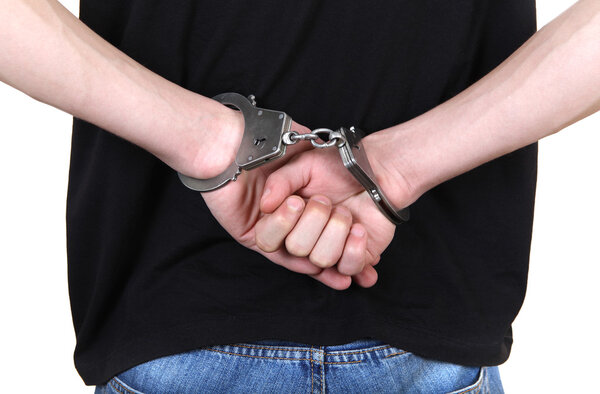 Handcuffs on Hands closeup