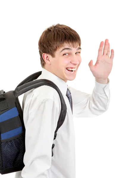 Student s batohu zamávat na rozloučenou — Stock fotografie