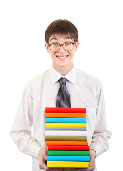 Feliz estudiante sosteniendo la pila de los libros — Foto de Stock