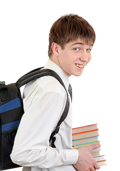 Estudiante con mochila sosteniendo los libros — Foto de Stock