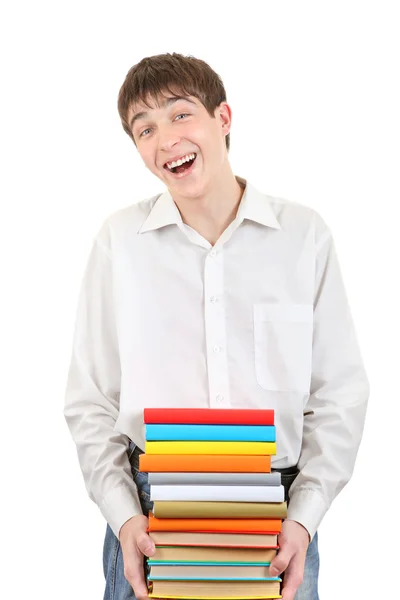 Szczęśliwy uczeń posiadający stos książek — Zdjęcie stockowe