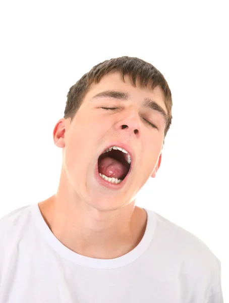 Молодой человек зевает — стоковое фото
