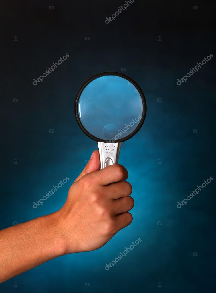 Hand with Loupe Stock Photo by ©sabphoto 33680089