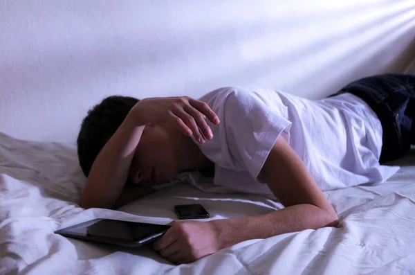Young Man Sleeps with Tablet