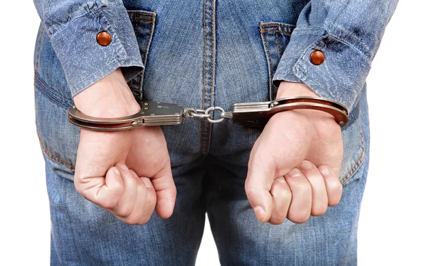 Handcuffs on Hands closeup — Stock Photo, Image