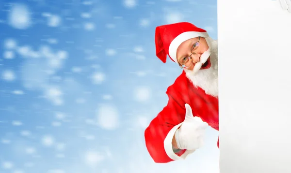 Santa claus met leeg bord — Stockfoto