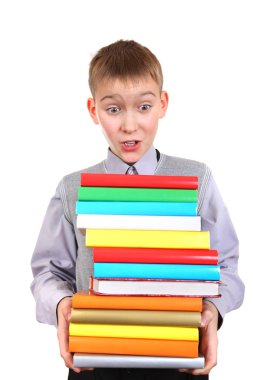 yığın kitap tutan çocuk