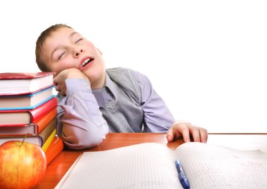 sıkılmış bir okul çocuğu uyuyor