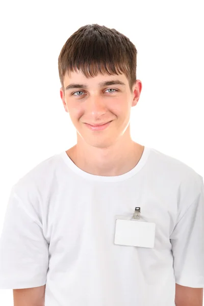 Teenager s prázdnou odznak — Stock fotografie