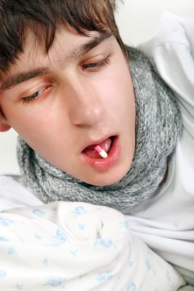 Sick Young Man with a Pill — Stock Photo, Image