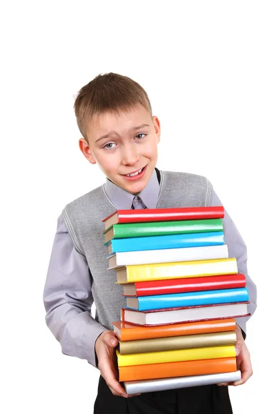 Ragazzo che tiene Mucchio dei Libri — Foto Stock