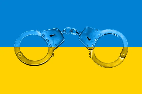 Bandiera ucraina e manette — Foto Stock