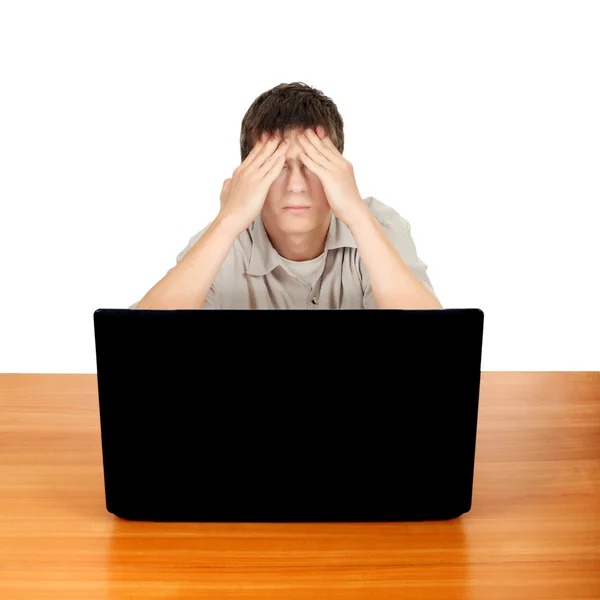Teenager stanco con computer portatile — Foto Stock