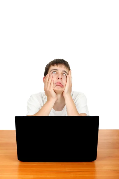 Aburrido adolescente con ordenador portátil — Foto de Stock