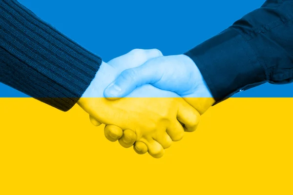 Händedruck und ukrainische Flagge — Stockfoto