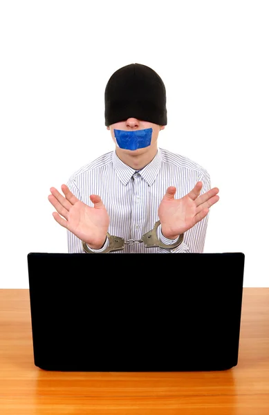 Hostage in Handcuffs behind Laptop — Stock Photo, Image
