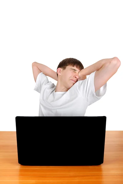 Tired Teenager behind Laptop — Stock Photo, Image