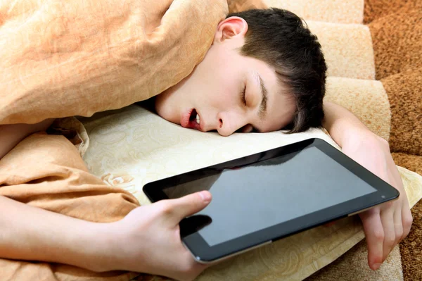 Adolescente duerme con Tablet Imagen de stock