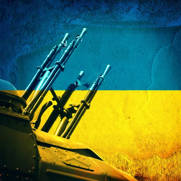 Waffe auf ukrainischer Flagge — Stockfoto