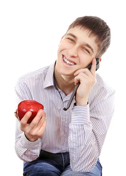 Teenager mit Apfel und Handy — Stockfoto