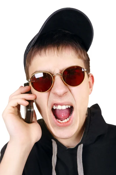 Rozzlobený teenager mobilní telefon — Stock fotografie