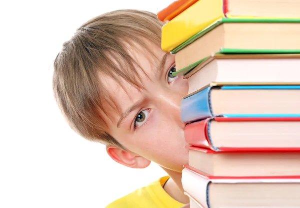 Triste chico detrás de los libros — Foto de Stock