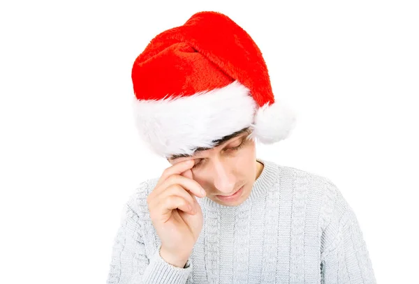 悲哀的年轻人在圣诞老人的帽子孤立在白色的背景 — 图库照片
