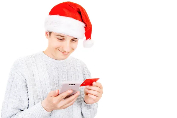 Happy Young Man Santa Hat Ένα Τηλέφωνο Και Μια Τραπεζική — Φωτογραφία Αρχείου