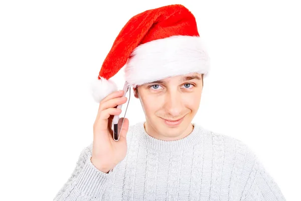 Νεαρός Άνδρας Στο Santa Hat Ένα Τηλέφωνο Απομονωμένο Στο Λευκό — Φωτογραφία Αρχείου