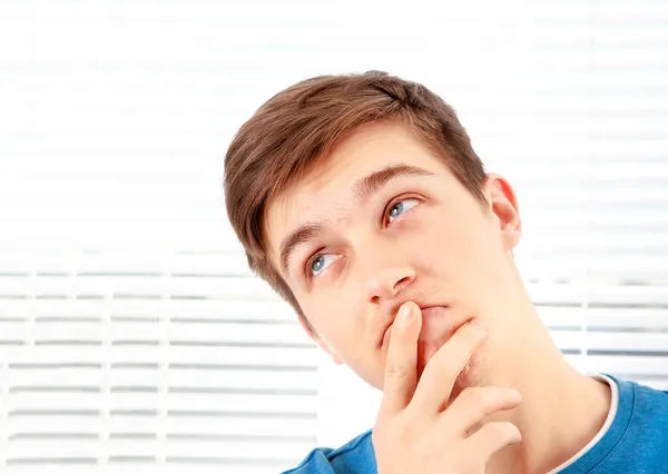 Young Man Thinking Jalousie Background Room — Stock Photo, Image