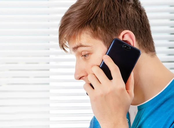 Young Man Speak Phone Room Closeup — Stockfoto