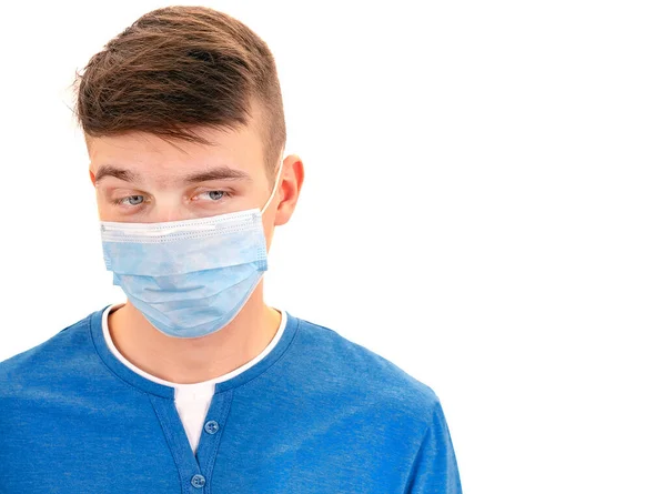 身穿白色背景的流感面具的可悲的年轻人 图库图片